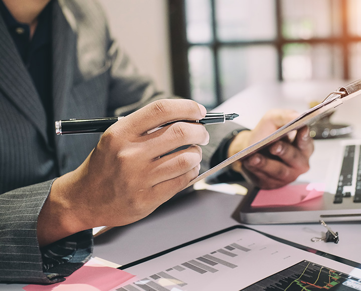 Man with pen - About Orion Assessment Services